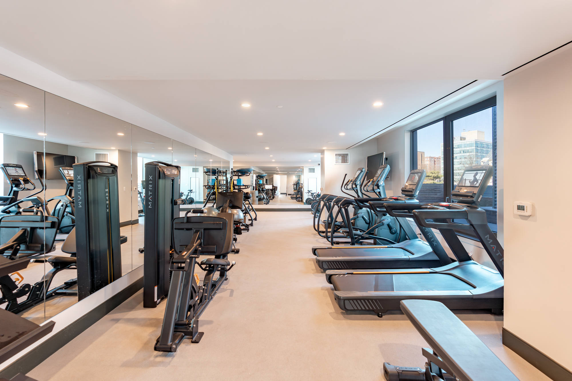 Bright fitness center with ample machines